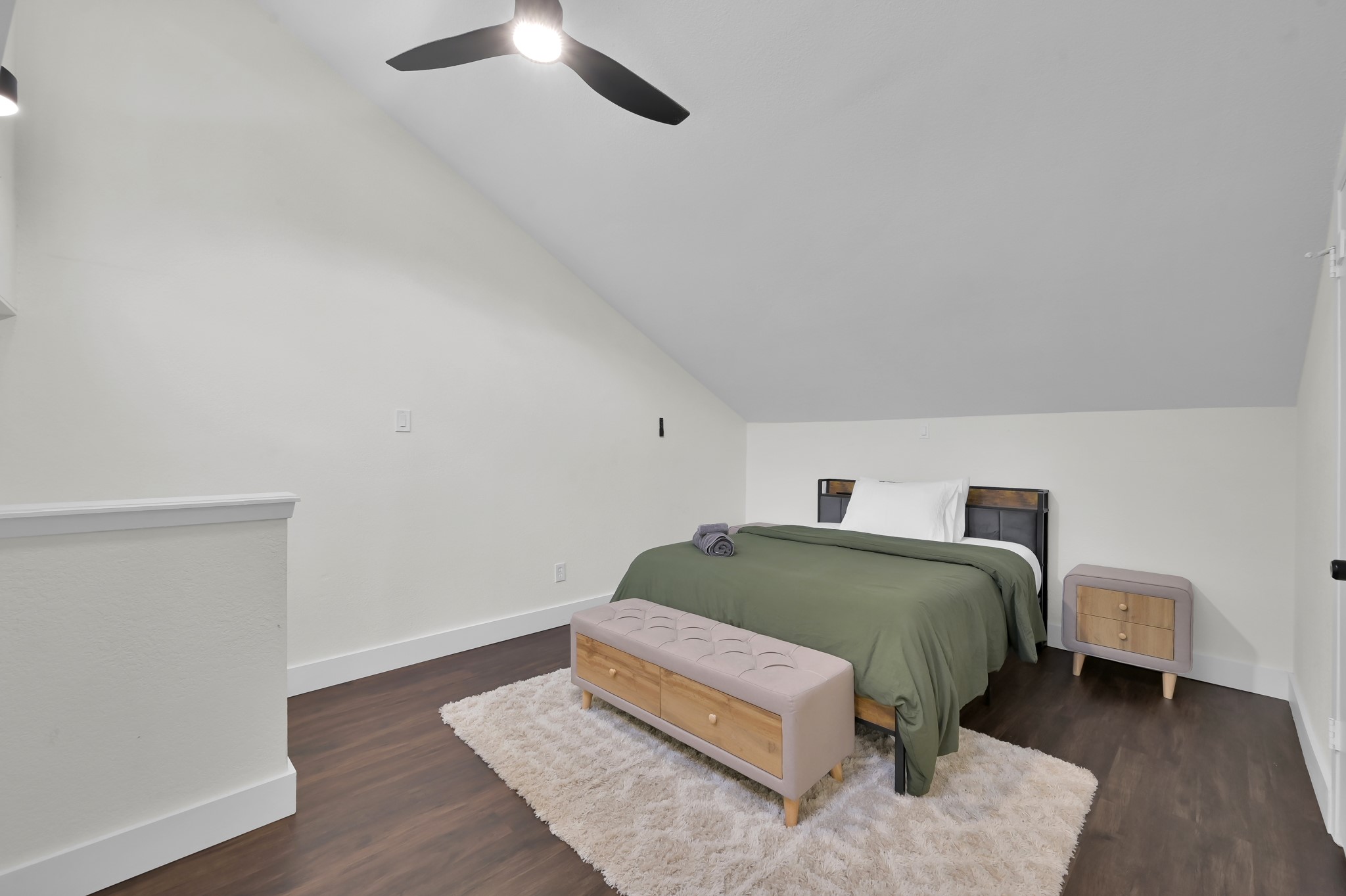 12900 Walden Road, Unit 506E Montgomery, TX 77356 - Photo 12 of 31 a living room with a bed and a table