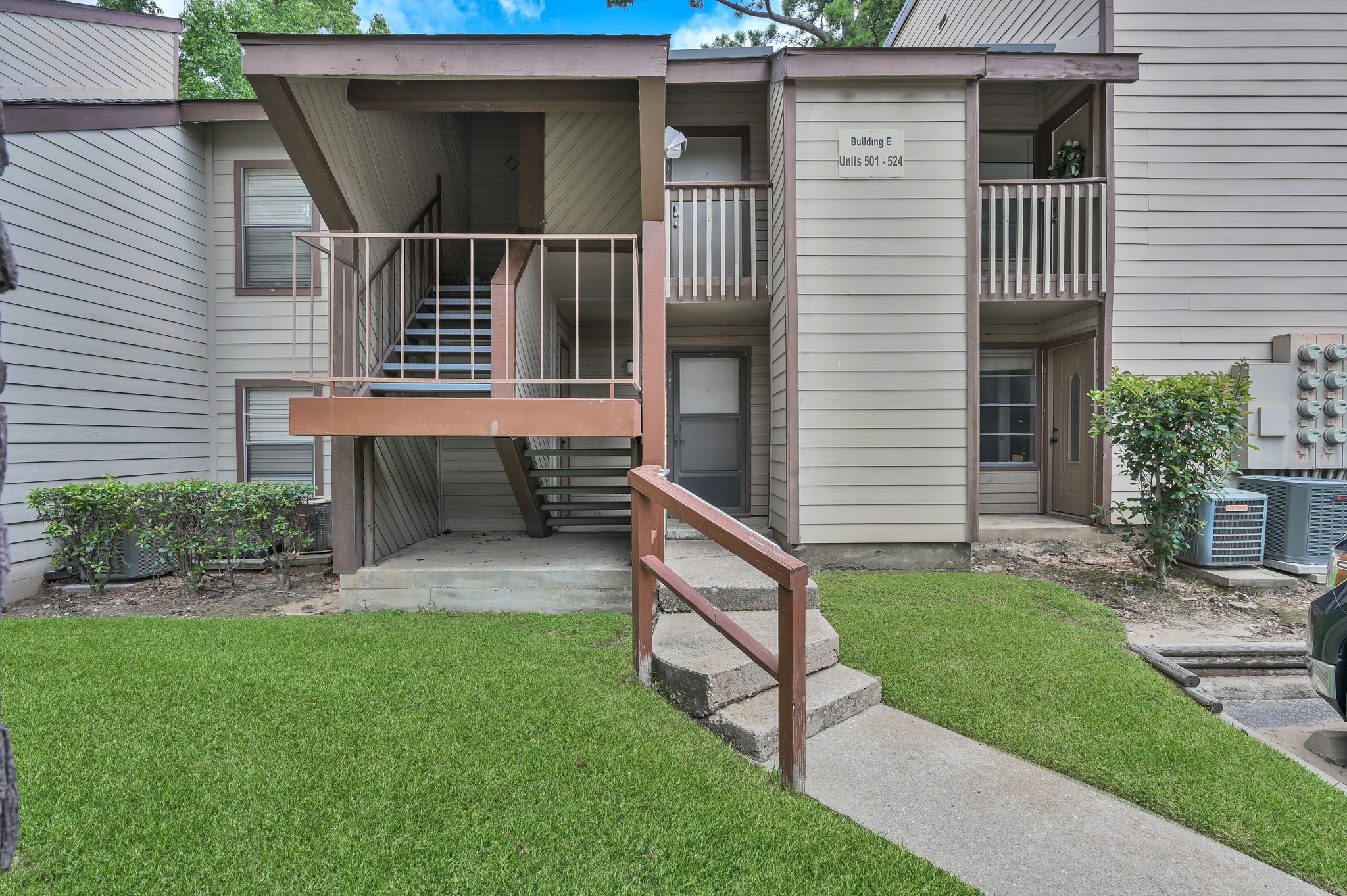 12900 Walden Road, Unit 506E Montgomery, TX 77356 - Photo 15 of 31 a front view of a house with garden