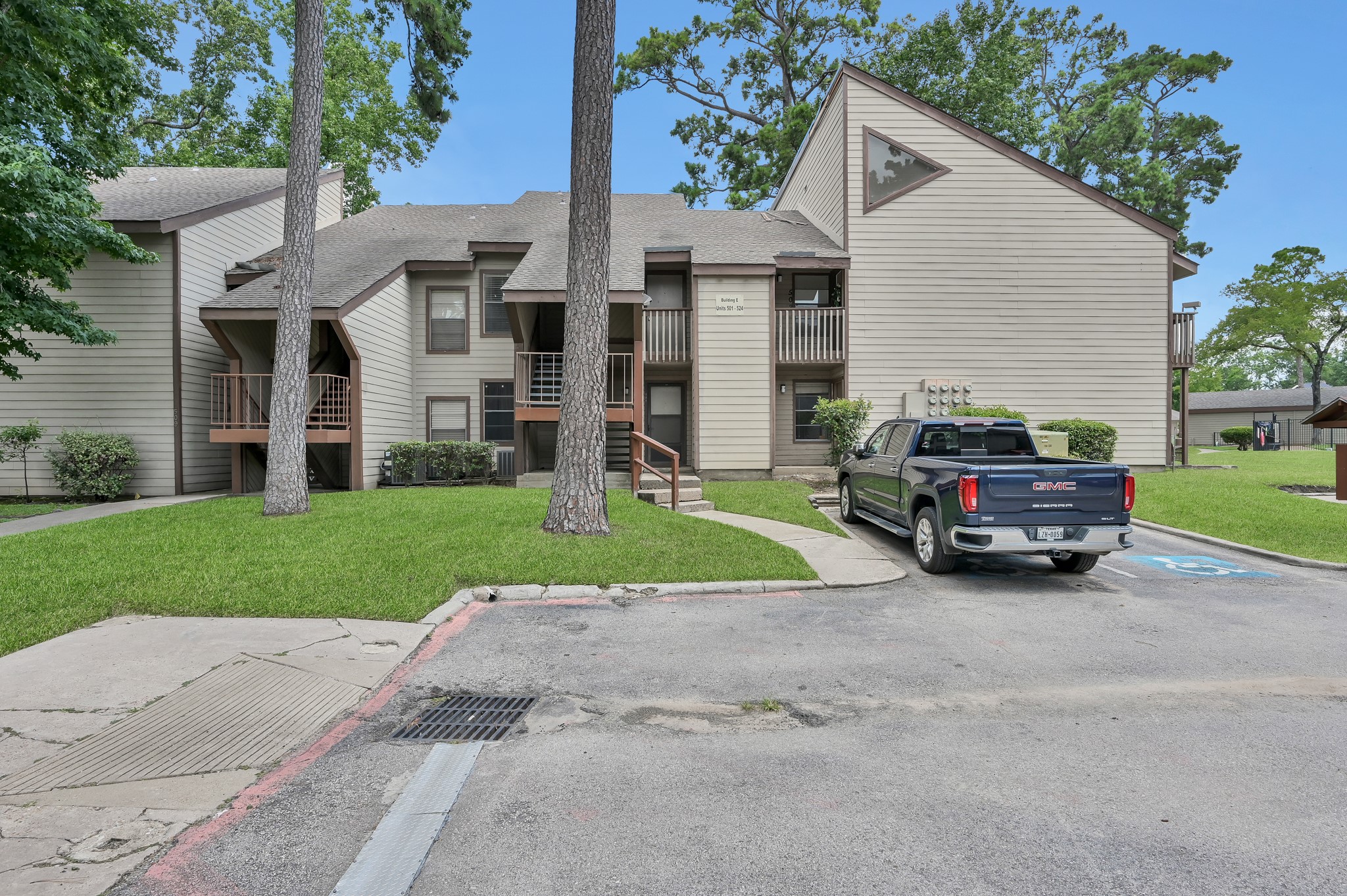 12900 Walden Road, Unit 506E Montgomery, TX 77356 - Photo 16 of 31 front view of a house with a yard