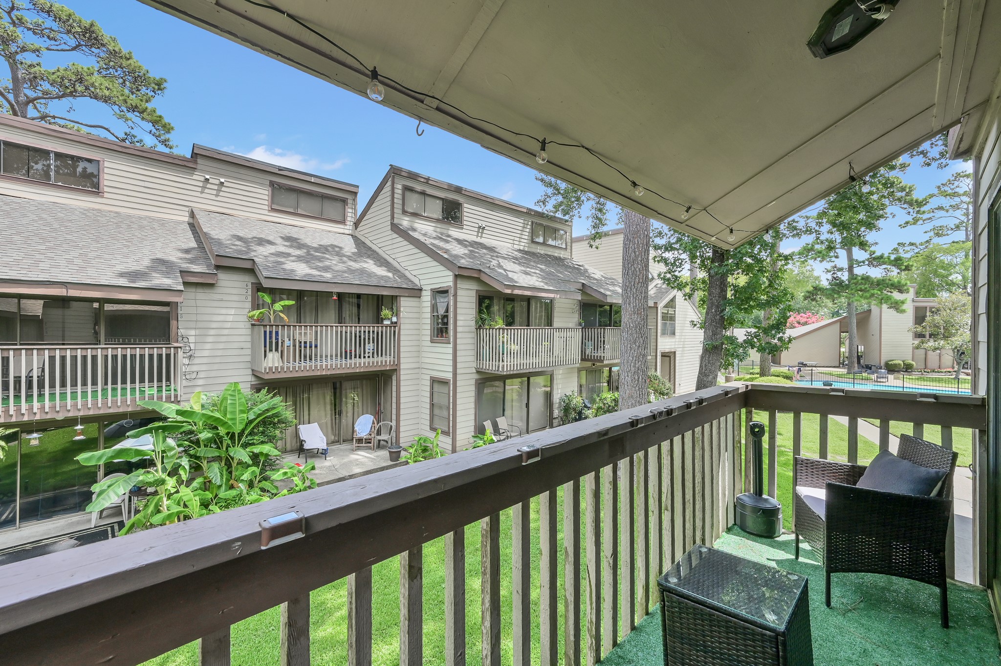 12900 Walden Road, Unit 506E Montgomery, TX 77356 - Photo 17 of 31 a view of a brick house with large windows and a table