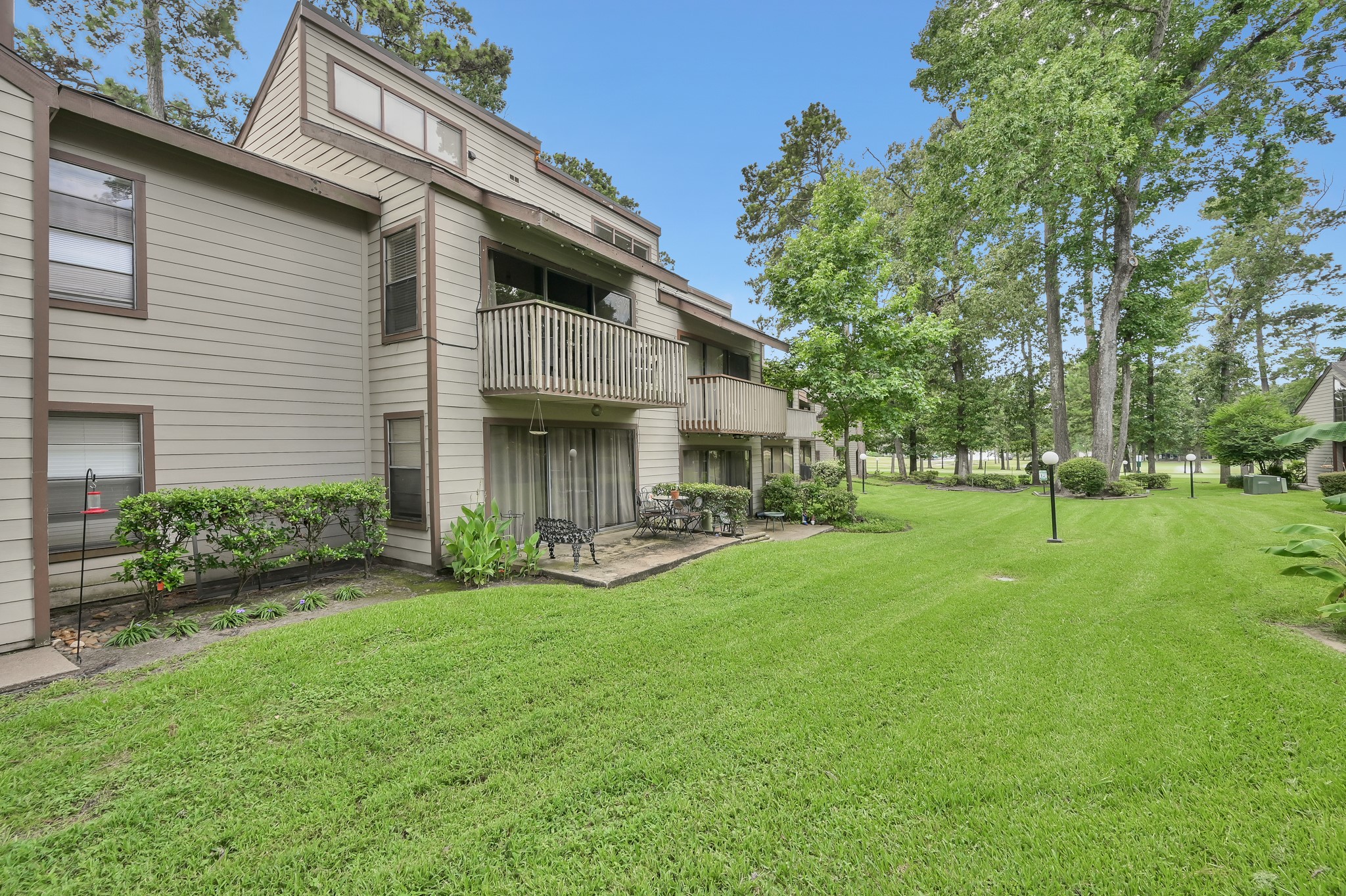 12900 Walden Road, Unit 506E Montgomery, TX 77356 - Photo 18 of 31 front view of a house with a yard