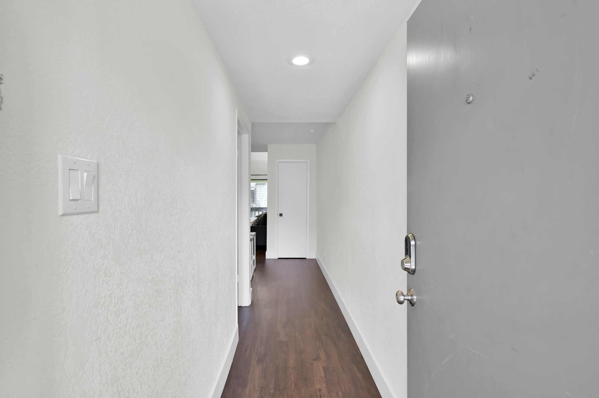 12900 Walden Road, Unit 506E Montgomery, TX 77356 - Photo 2 of 31 a view of a hallway with wooden floor