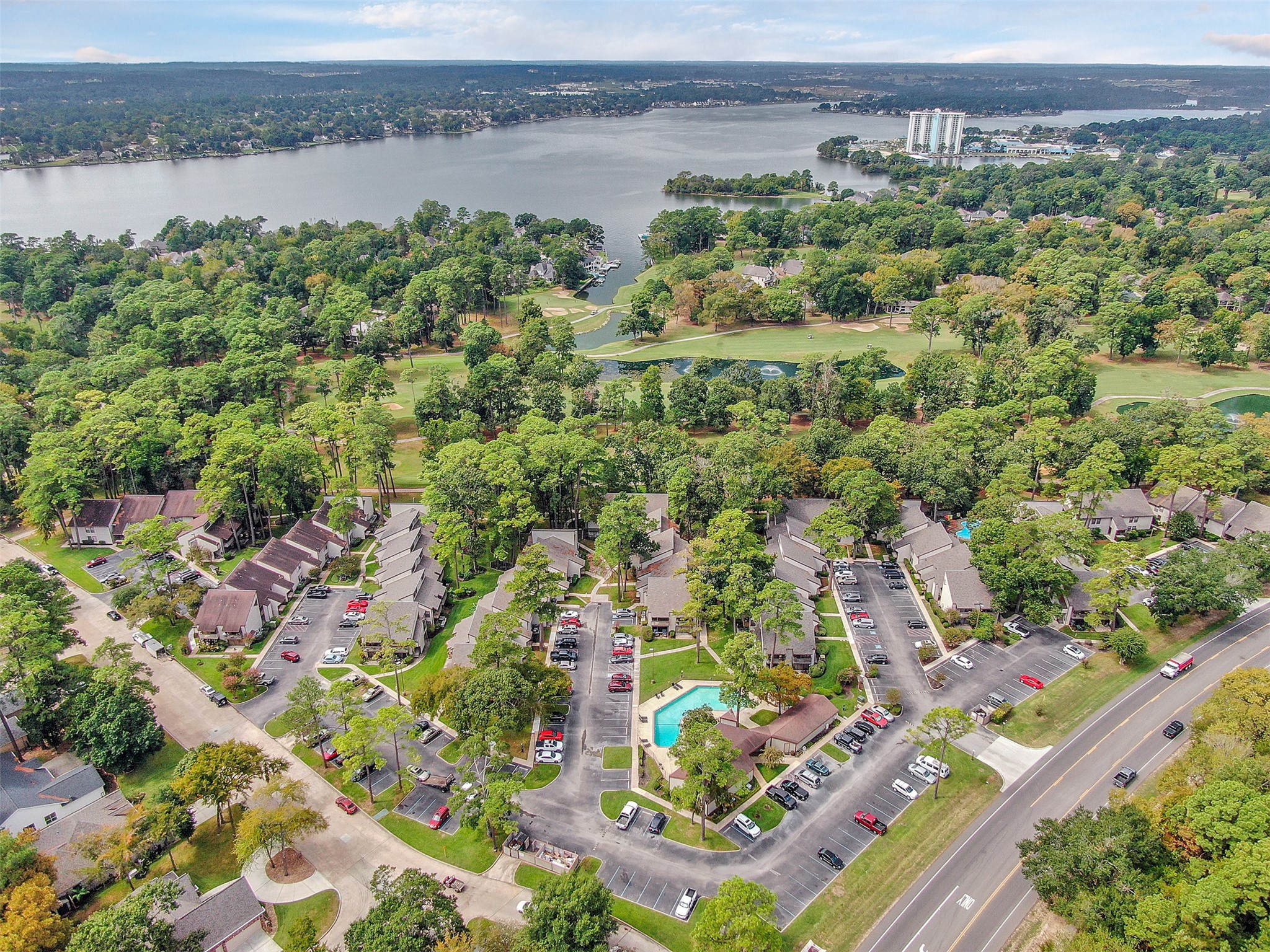 12900 Walden Road, Unit 506E Montgomery, TX 77356 - Photo 24 of 31 a view of a lake with a city view