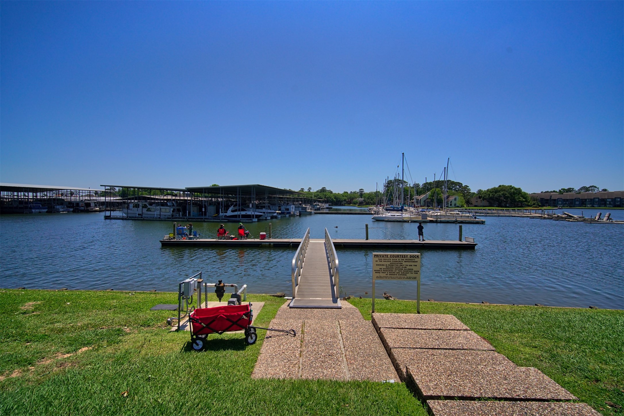 12900 Walden Road, Unit 506E Montgomery, TX 77356 - Photo 26 of 31 a view of a backyard with sitting area