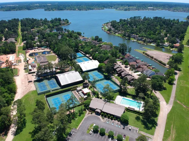 an aerial view of multiple houses with yard