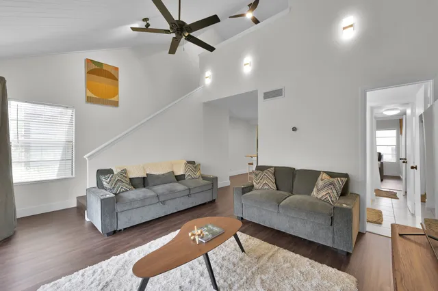 a living room with furniture and a window