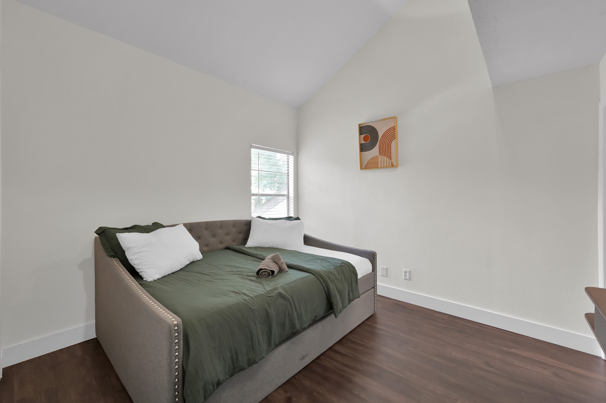 12900 Walden Road, Unit 506E Montgomery, TX 77356 - Photo 9 of 31 a bed sitting in a bedroom next to a window