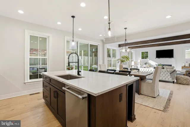 a patio with patio couch and a view of the glass windows