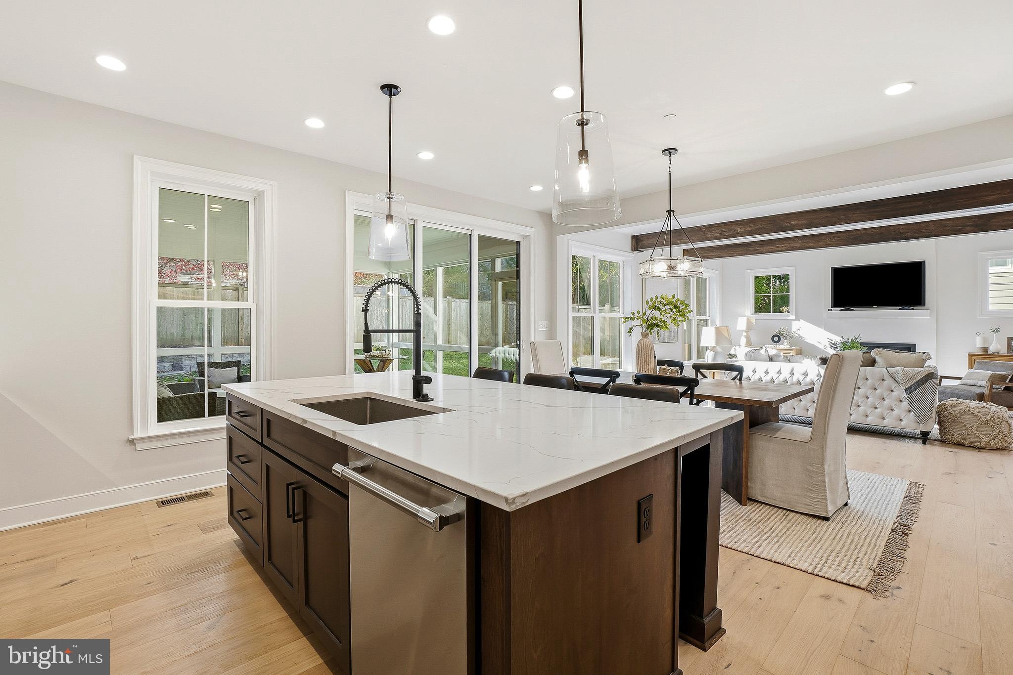 8802 Ridge Road Bethesda, MD 20817 - Photo 14 of 26 a kitchen that has a sink a stove and a table with chairs