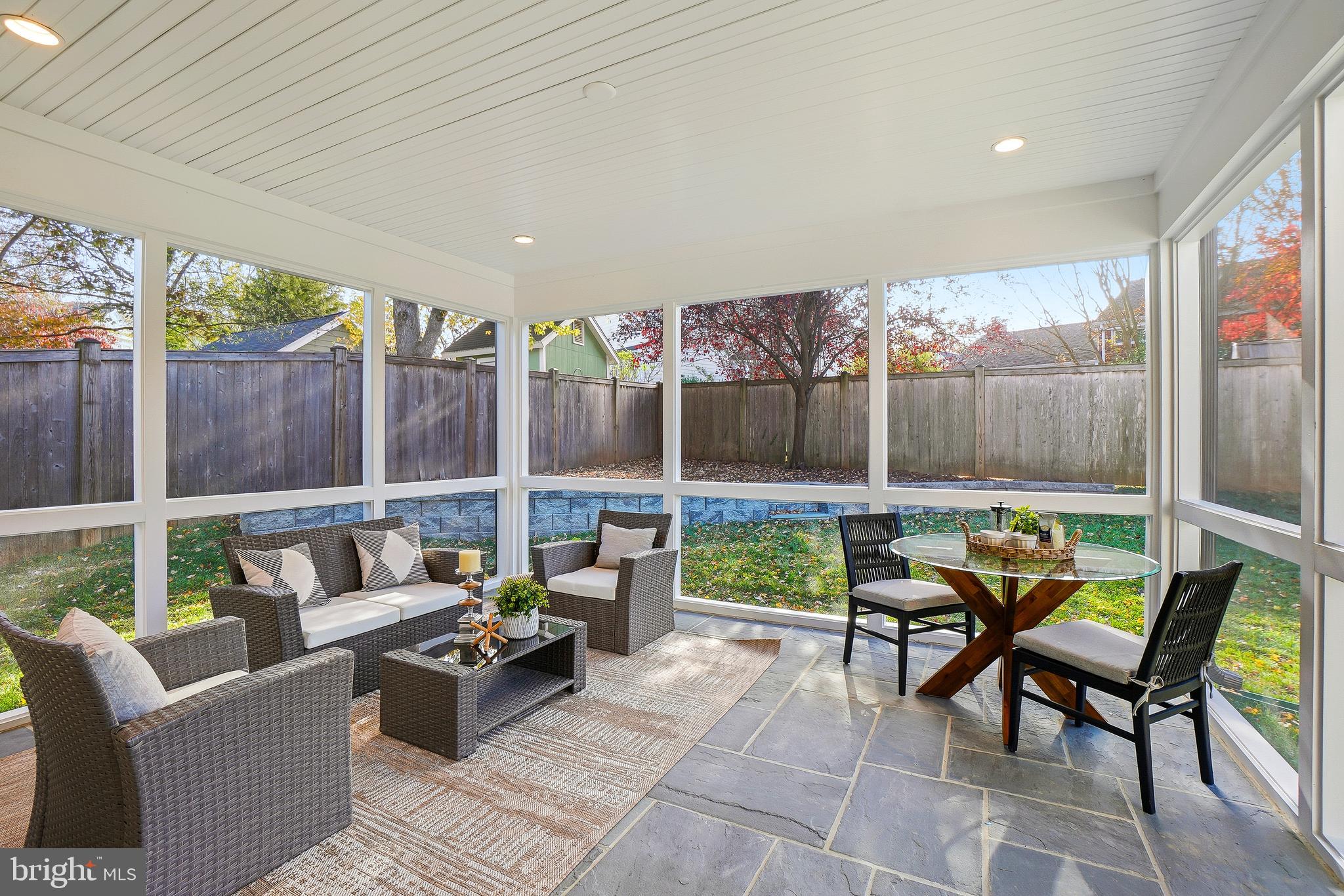8802 Ridge Road Bethesda, MD 20817 - Photo 16 of 26 a patio with patio couch and a view of the glass windows