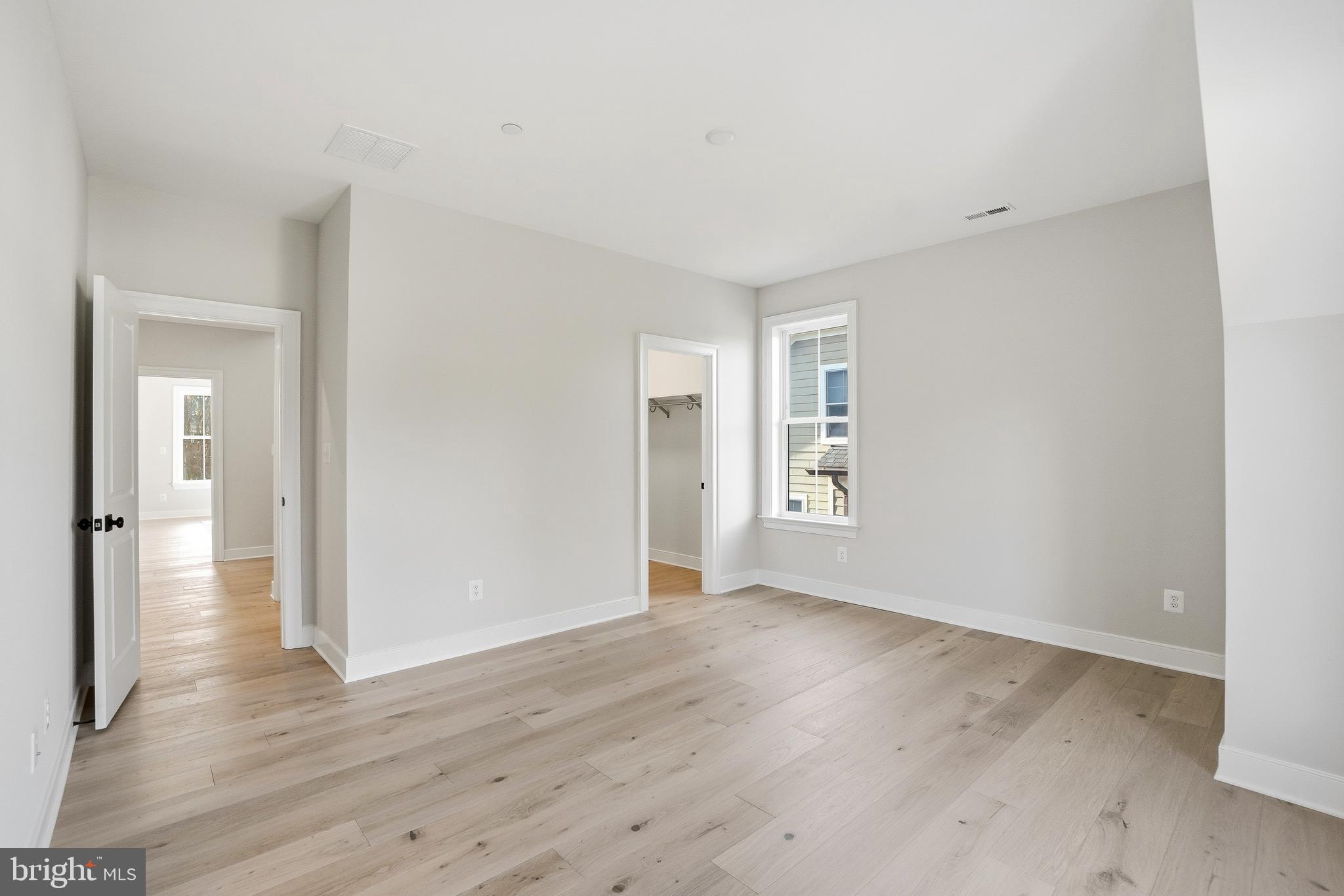 8802 Ridge Road Bethesda, MD 20817 - Photo 18 of 26 a view of an empty room with wooden floor and a window