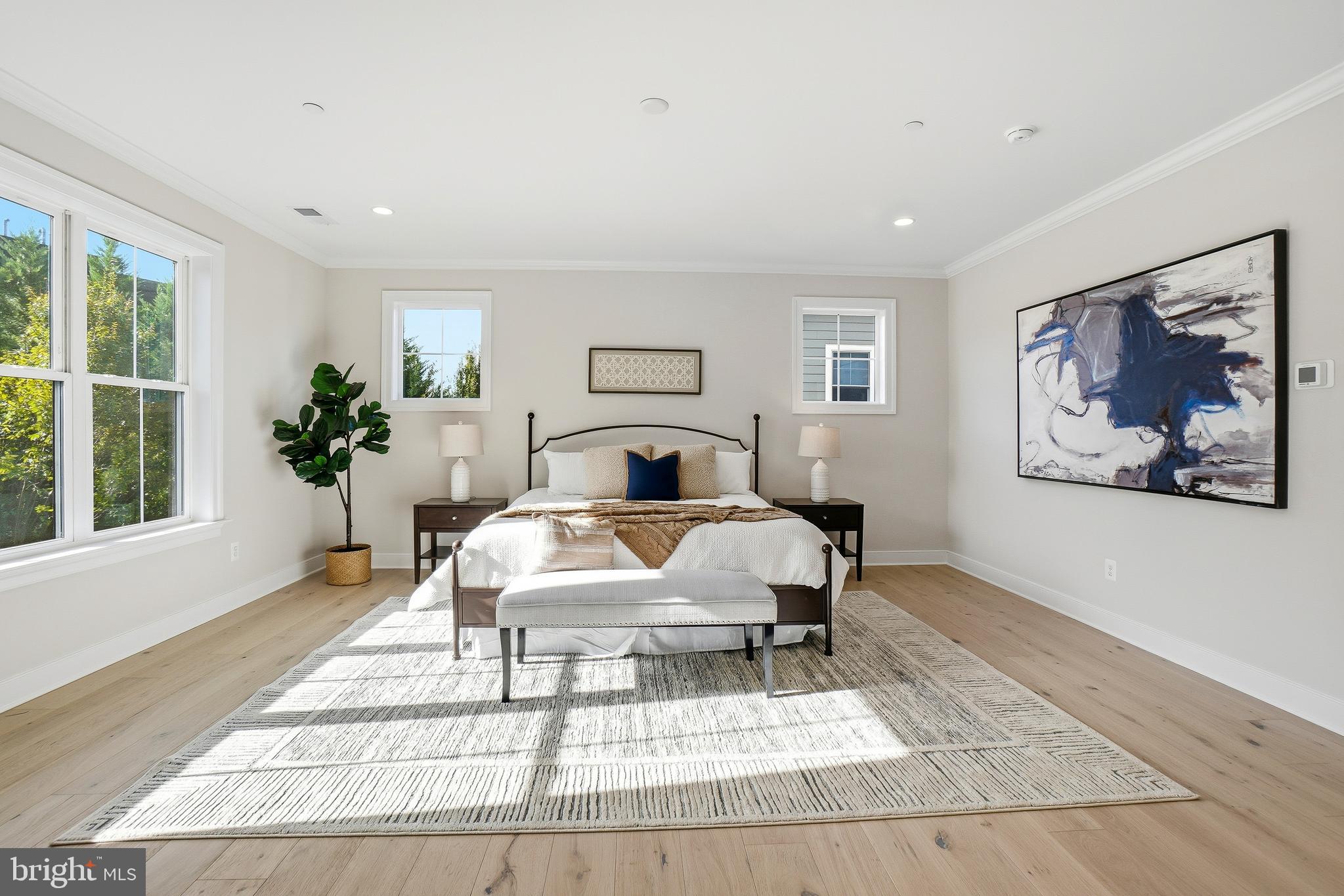 8802 Ridge Road Bethesda, MD 20817 - Photo 20 of 26 a bed room with a bed and a painting on the wall