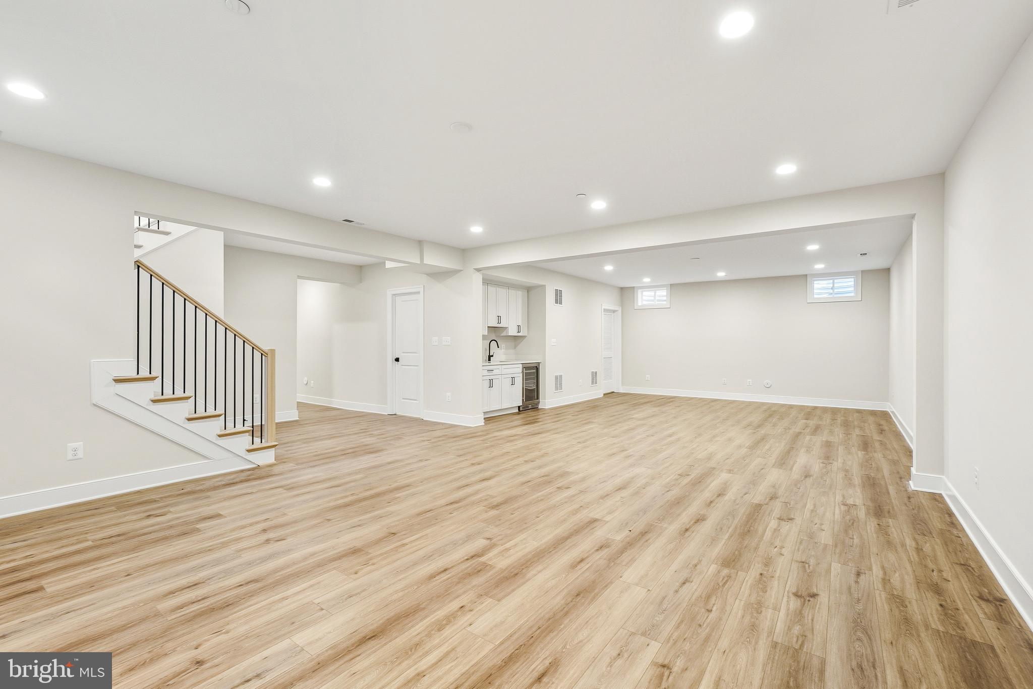 8802 Ridge Road Bethesda, MD 20817 - Photo 25 of 26 a view of empty room with wooden floor