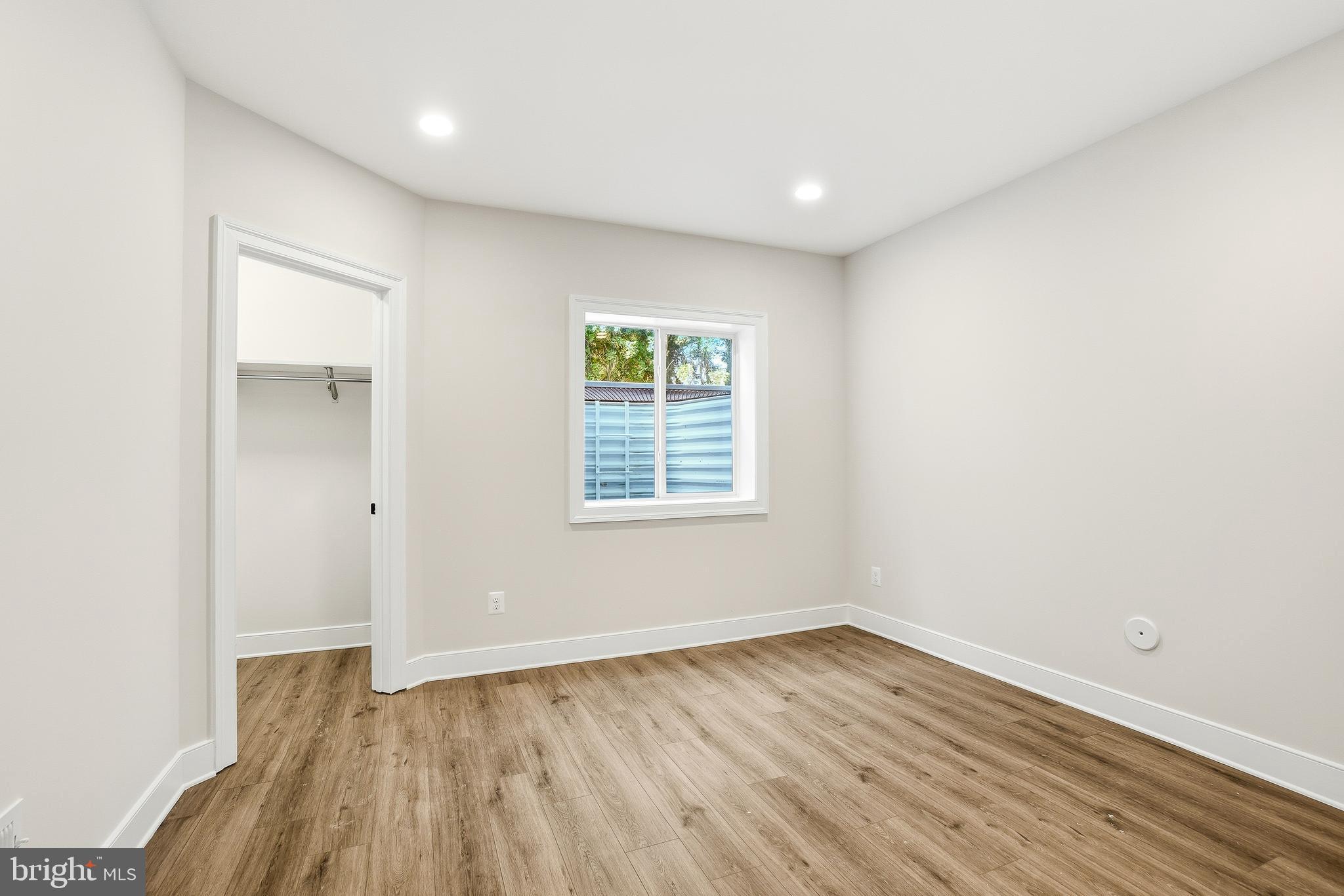 8802 Ridge Road Bethesda, MD 20817 - Photo 26 of 26 an empty room with wooden floor and windows