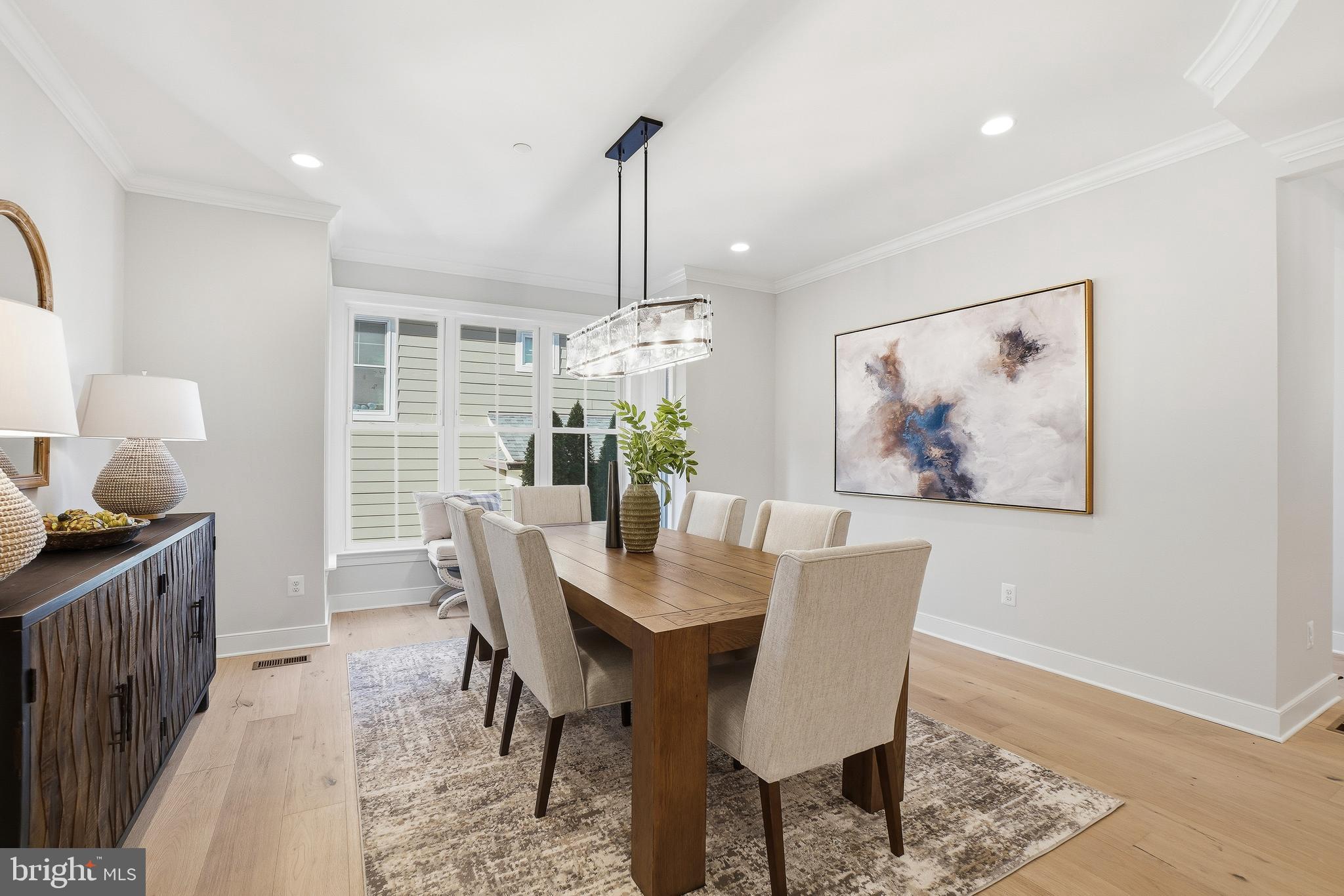 8802 Ridge Road Bethesda, MD 20817 - Photo 6 of 26 a view of a dining room with furniture window and wooden floor