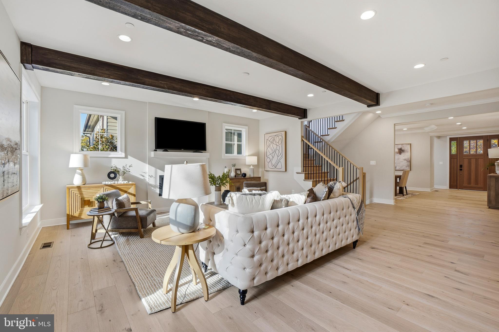 8802 Ridge Road Bethesda, MD 20817 - Photo 9 of 26 a living room with furniture and a flat screen tv