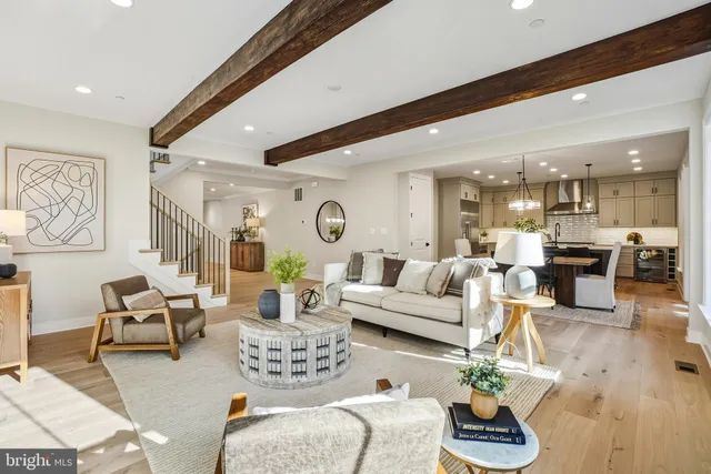 a kitchen with stainless steel appliances a stove a sink island and a refrigerator