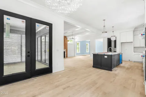 a view of a kitchen with a sink and a window
