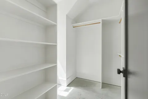 a view of an empty walk in closet