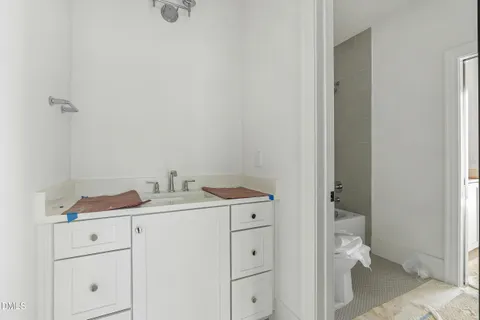 a utility room with cabinets washer and dryer