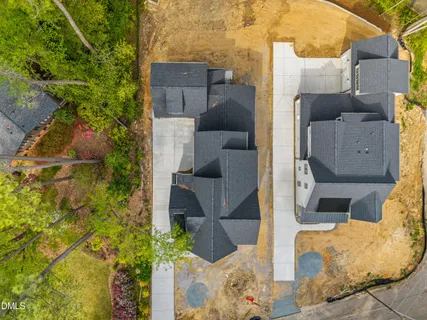 an aerial view of a house with a yard and garage