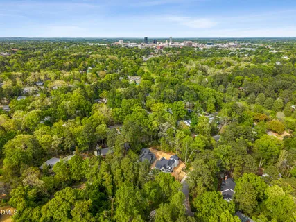 a view of a room with wooden floor and bench