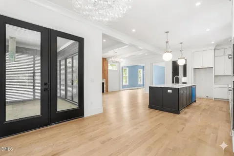 a view of a kitchen with a sink and a large window