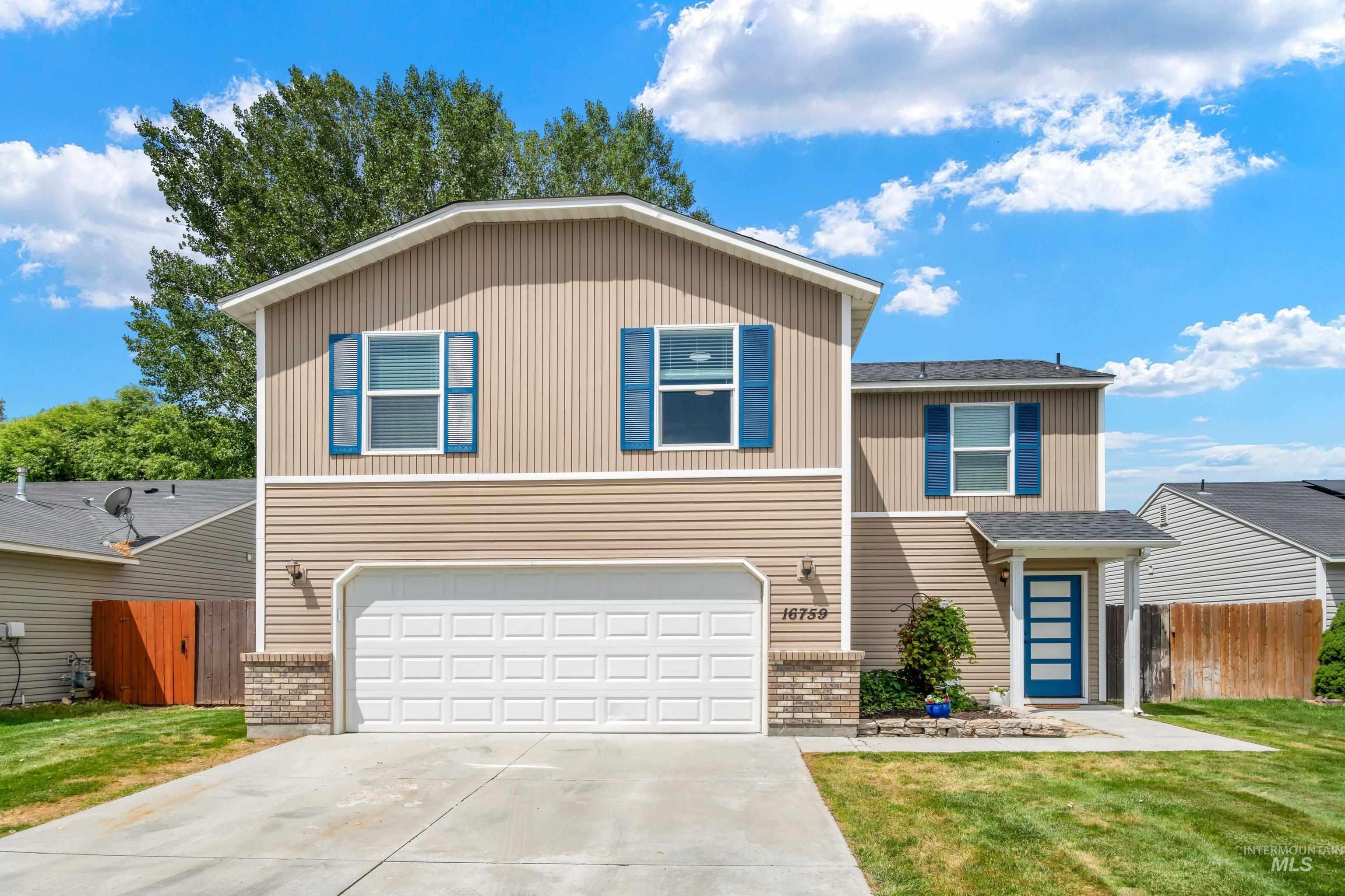 16759 Abram Avenue Caldwell, ID 83607 - Photo 2 of 33 Two-story home with tan siding and blue window shutters
