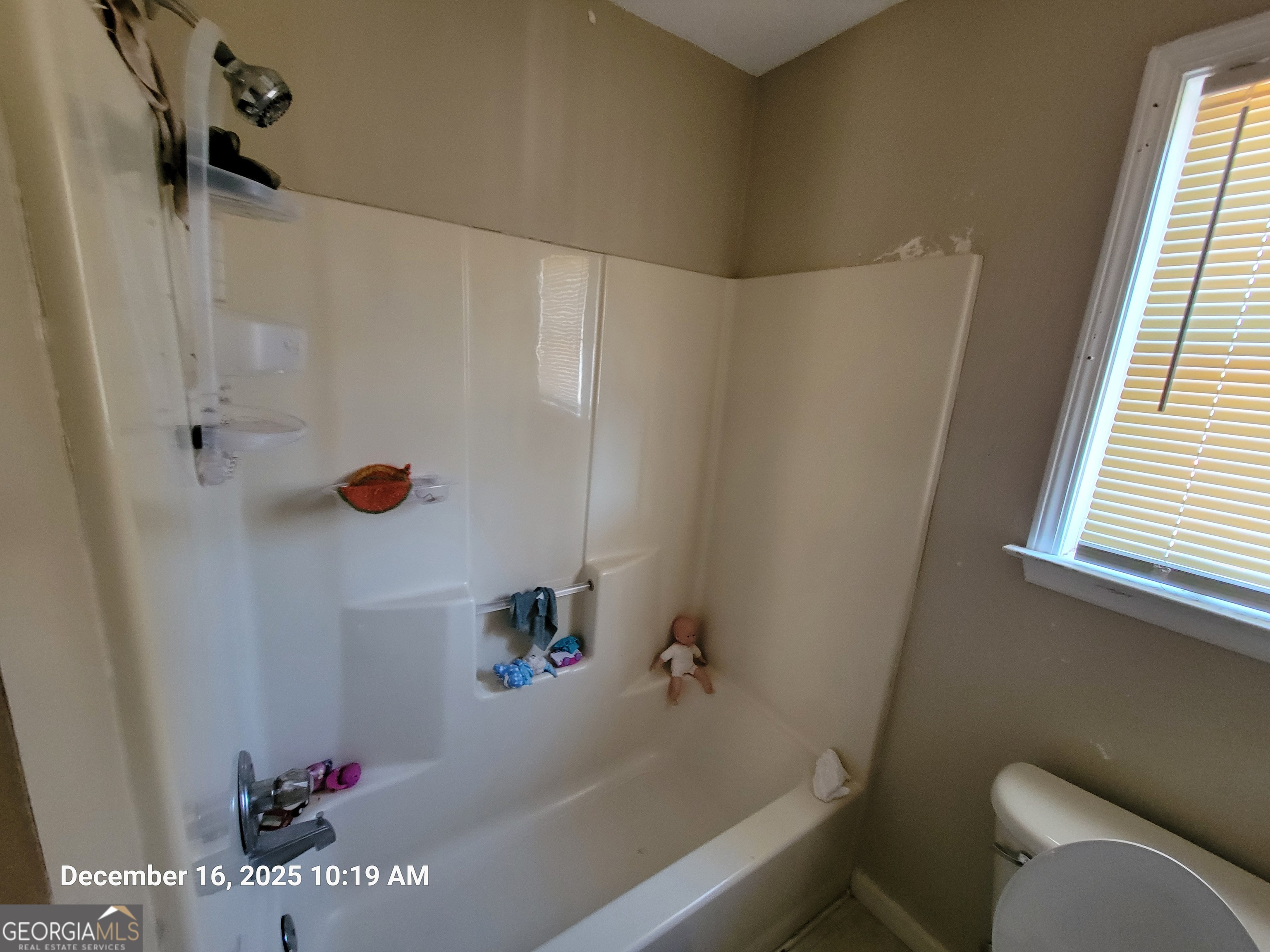 75 Short Street Macon, GA 31204 - Photo 19 of 23 a bathroom with a bathtub and shower