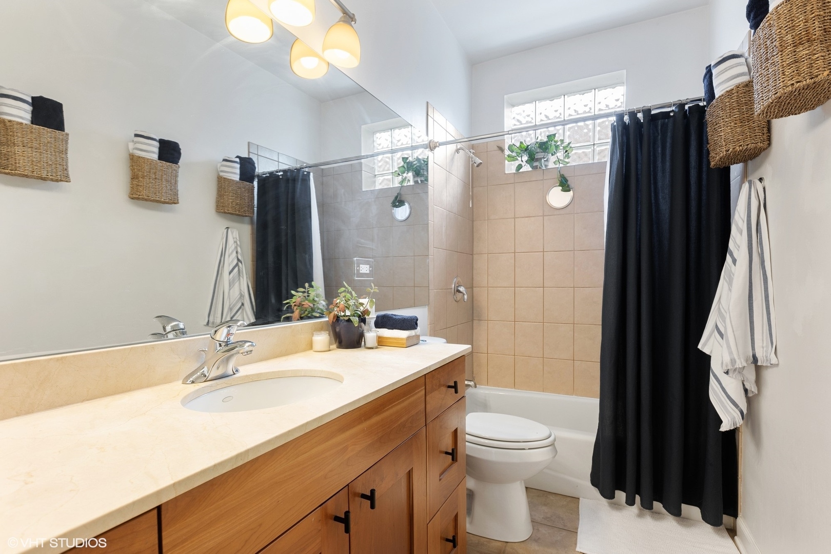 1512 West Victoria Street, Unit 2 Chicago, IL 60660 - Photo 14 of 19 a bathroom with a sink toilet double vanity and shower