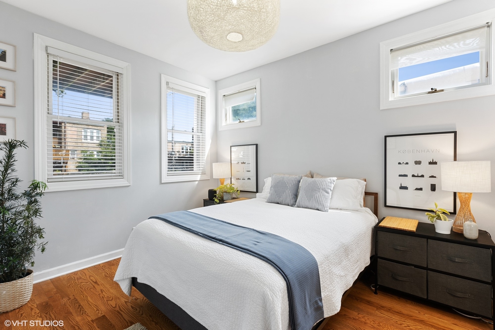 1512 West Victoria Street, Unit 2 Chicago, IL 60660 - Photo 15 of 19 a bedroom with a bed and wooden floor