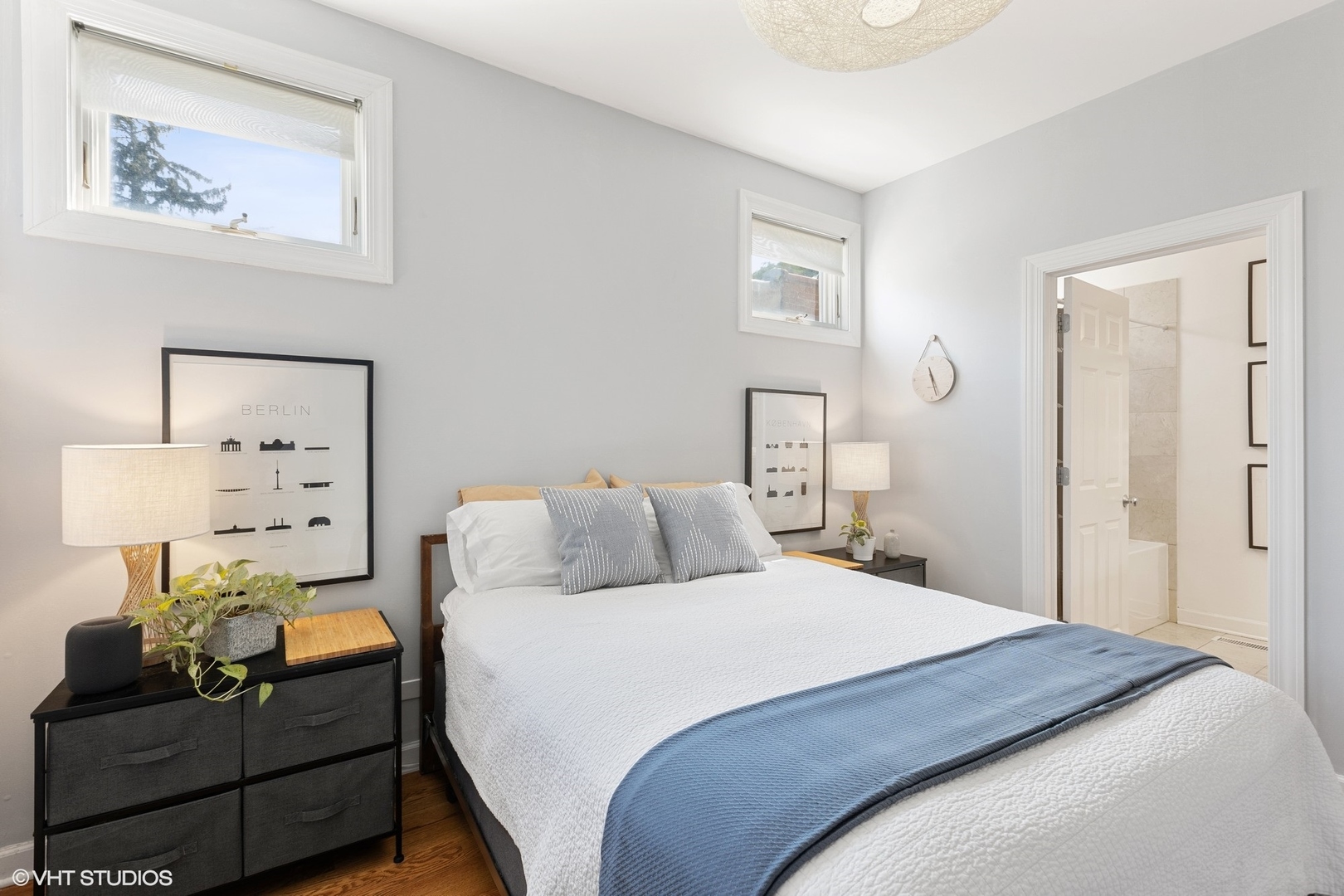 1512 West Victoria Street, Unit 2 Chicago, IL 60660 - Photo 16 of 19 a bedroom with a bed and wooden floor