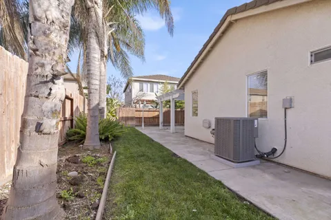 an aerial view of residential building with outdoor space and ocean view
