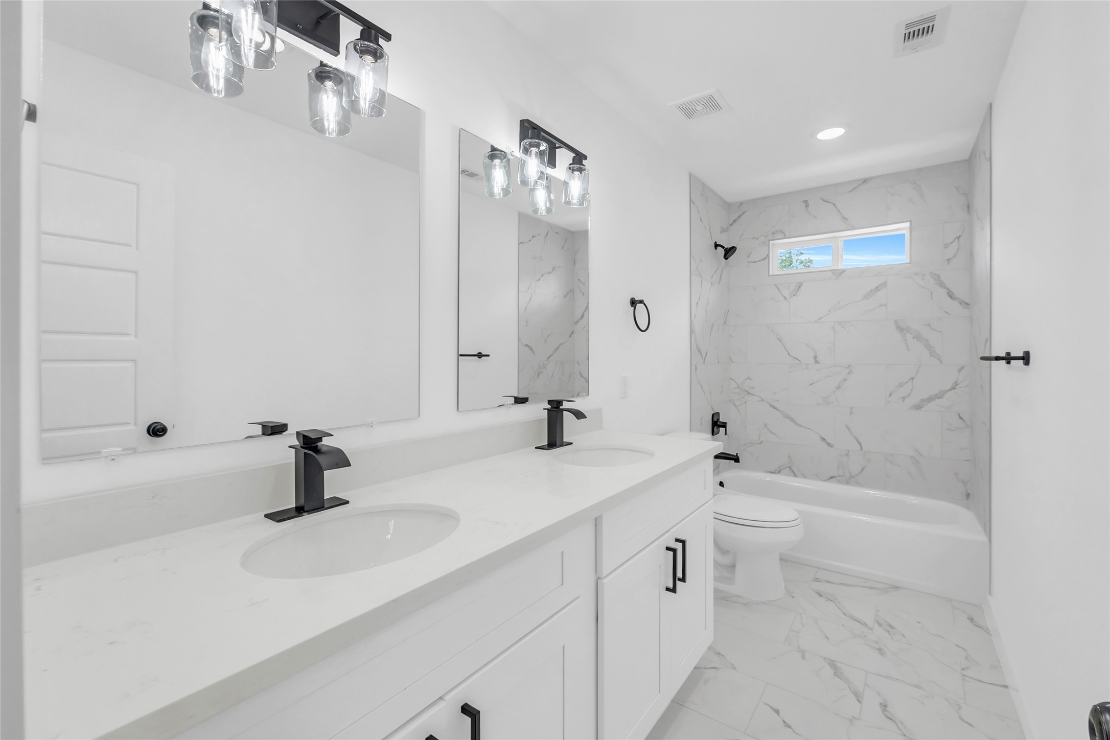 9818 Sandra Street, Unit B Houston, TX 77016 - Photo 15 of 19 a bathroom with a sink a toilet and shower