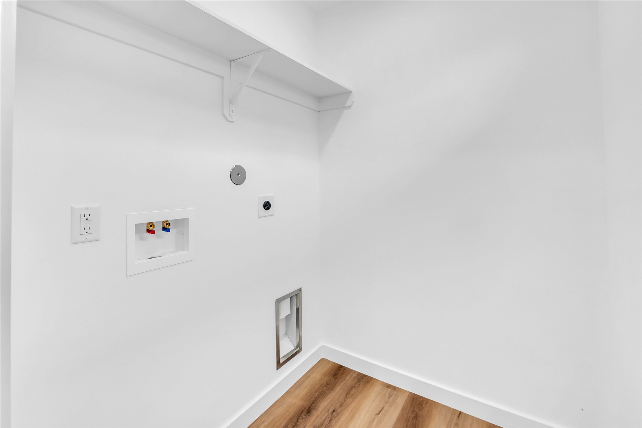 9818 Sandra Street, Unit B Houston, TX 77016 - Photo 16 of 19 a view of small space with racks on the wall