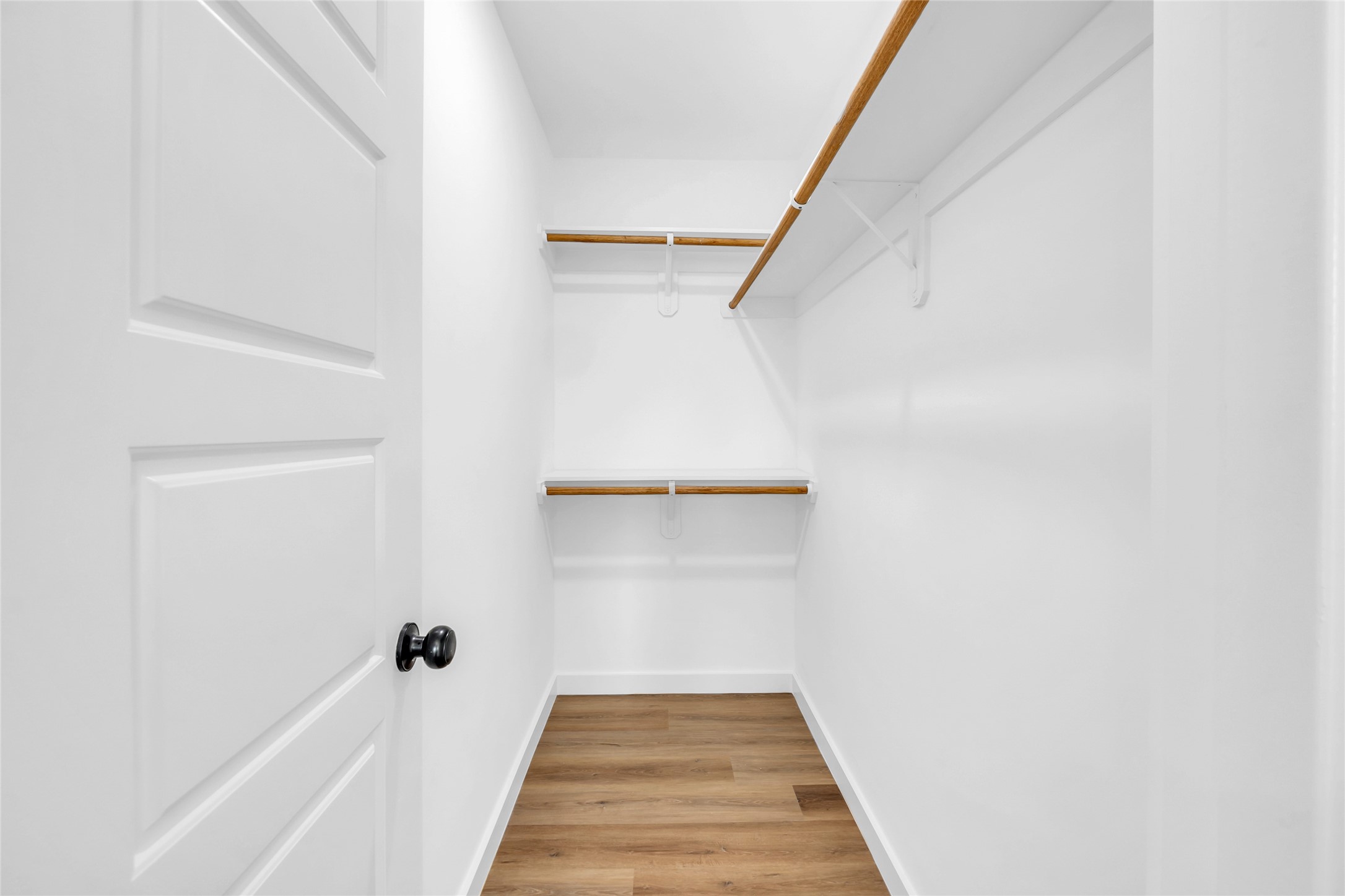 9818 Sandra Street, Unit B Houston, TX 77016 - Photo 10 of 19 a view of a hallway with wooden floor and staircase