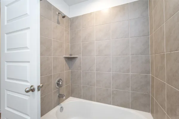 a view of kitchen with stainless steel appliances granite countertop a stove a refrigerator a sink and a oven with wooden floor