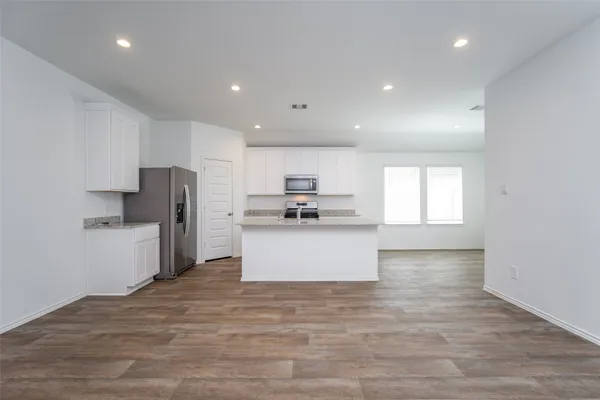 a kitchen with granite countertop counter top space cabinets and stainless steel appliances
