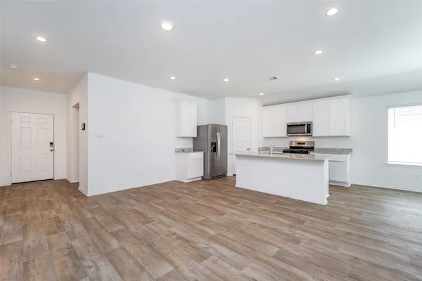 a kitchen with a sink and a window