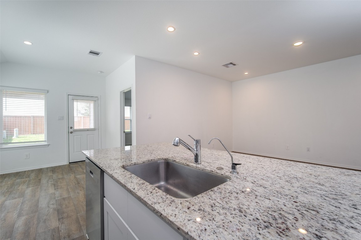 3726 Lanercost Lane Fulshear, TX 77441 - Photo 16 of 30 a kitchen with a sink and a window