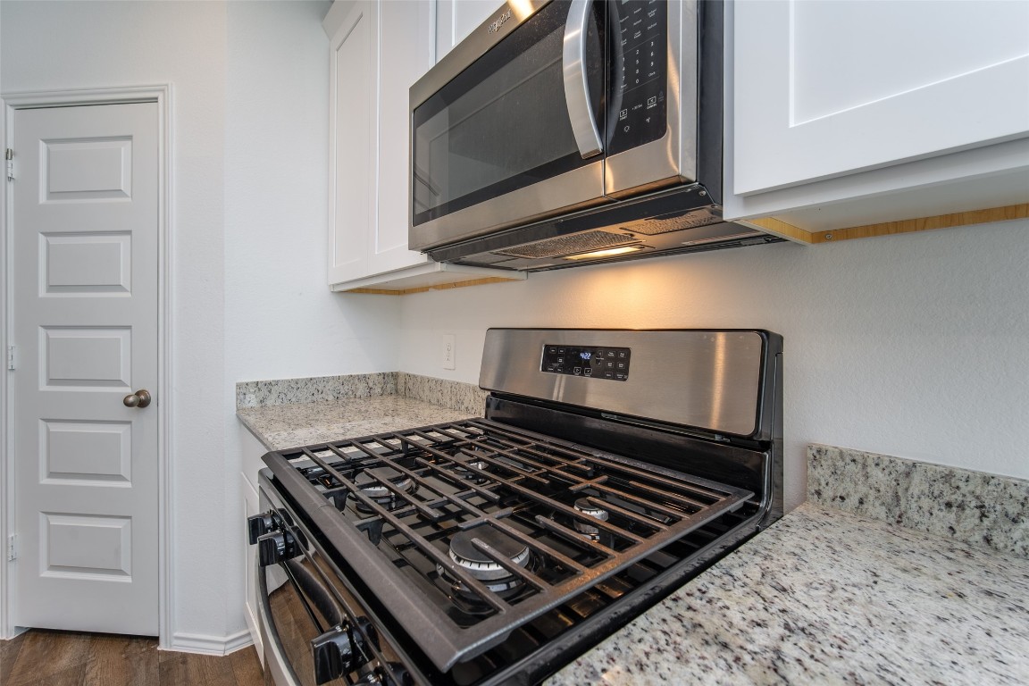 3726 Lanercost Lane Fulshear, TX 77441 - Photo 19 of 30 a stove top oven sitting inside of a kitchen