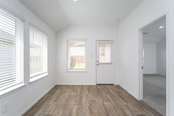 a view of kitchen with cabinets and wooden floor