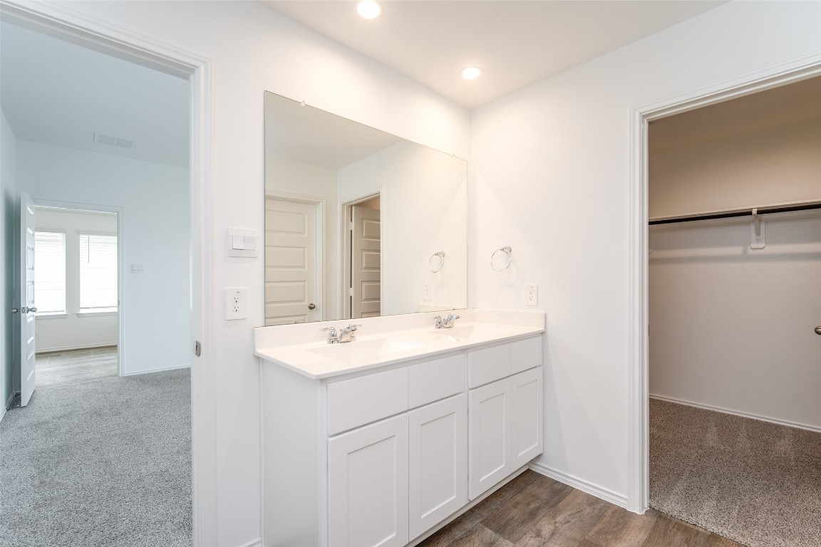 3726 Lanercost Lane Fulshear, TX 77441 - Photo 27 of 30 a view with a sink a mirror and a vanity