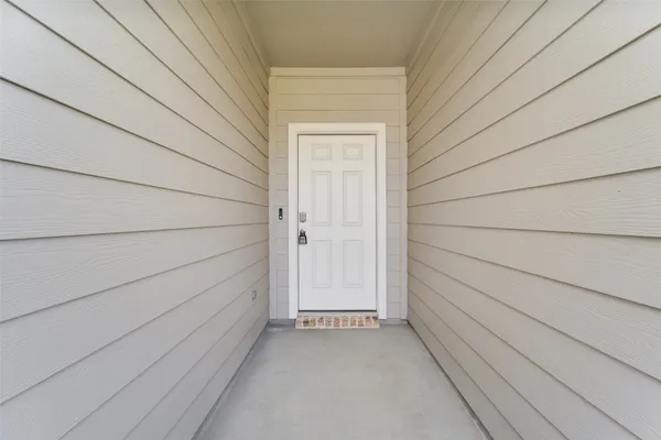 a view of a hallway with bathroom