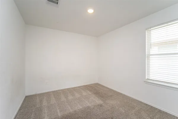 a bathroom with a sink mirror and vanity