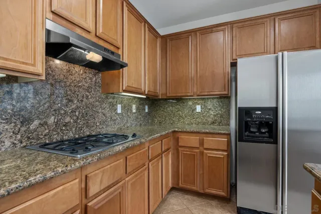 a bathroom with a bathtub and next to a window