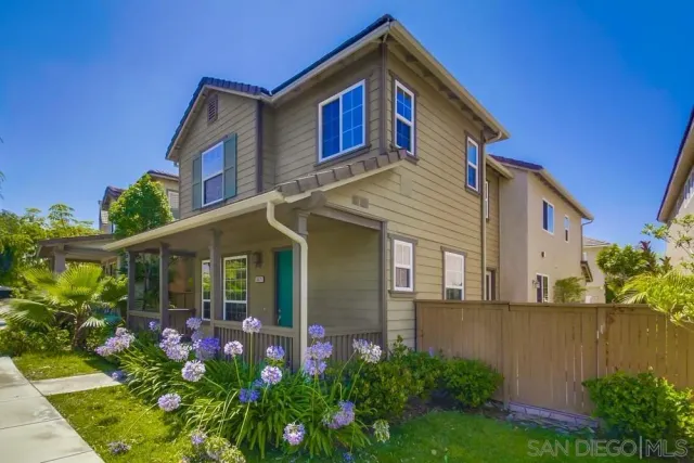 an empty room with wooden floor and fireplace