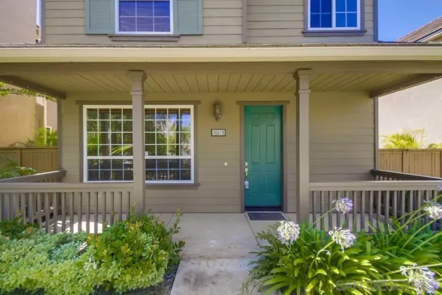 a kitchen with stainless steel appliances granite countertop a stove a sink and a refrigerator with wooden floor