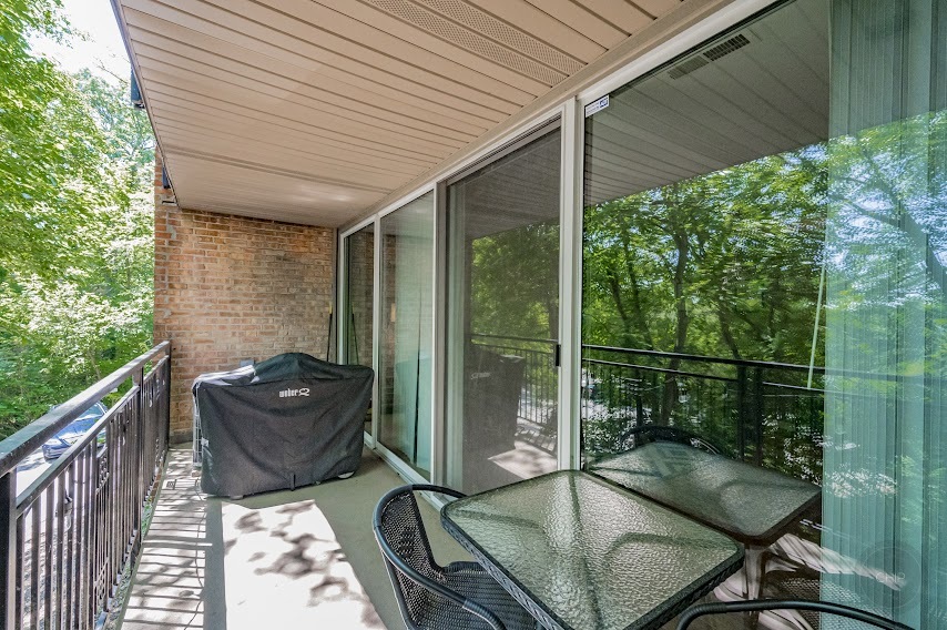 5904 Forest View Road, Unit 2F Lisle, IL 60532 - Photo 24 of 28 a backyard of a house with outdoor seating