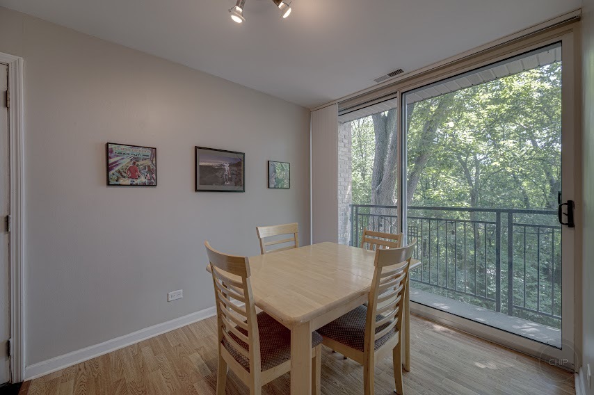 5904 Forest View Road, Unit 2F Lisle, IL 60532 - Photo 7 of 28 a view of a dining room with furniture window and wooden floor